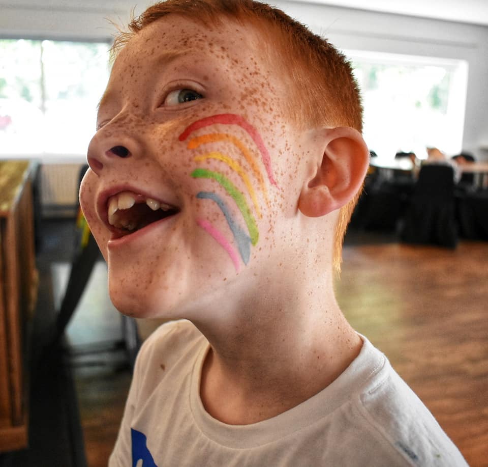 Sonny with rainbow facepaint